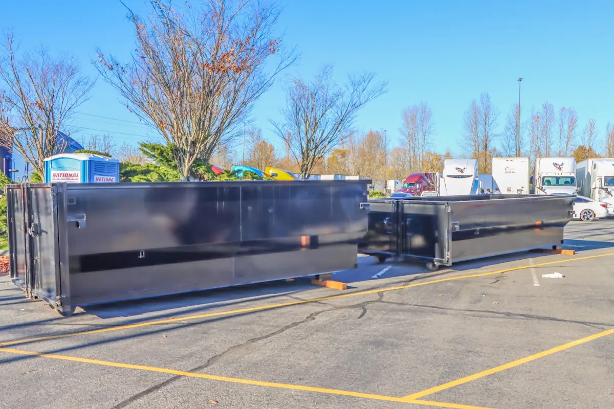 Professional dumpster rental service with roll-off container on residential driveway in Orlovista
